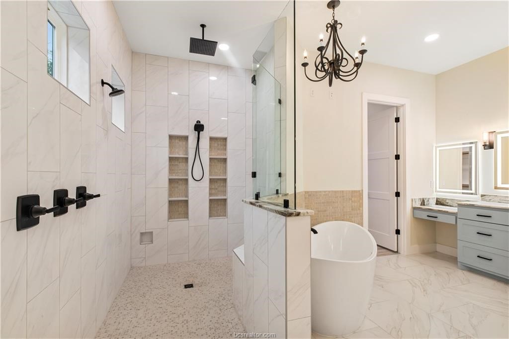 Lot 9 Old Hickory Trail Franklin, TX 77856 - Photo 29 of 41 a bathroom with a tub sink and mirror