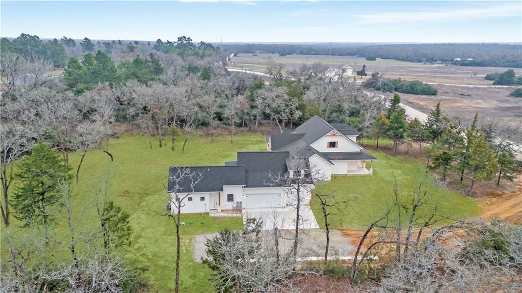 Lot 9 Old Hickory Trail Franklin, TX 77856 - Photo 38 of 41 an aerial view of a house with a garden and lake view