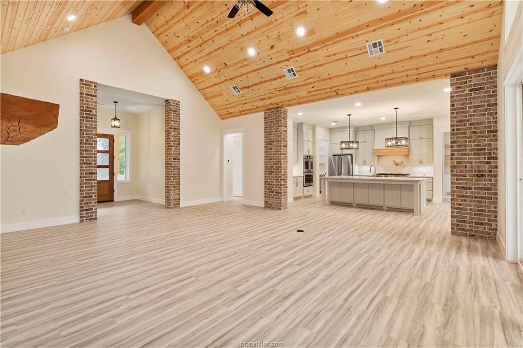 Lot 9 Old Hickory Trail Franklin, TX 77856 - Photo 5 of 41 a view of a room with wooden floor and natural light
