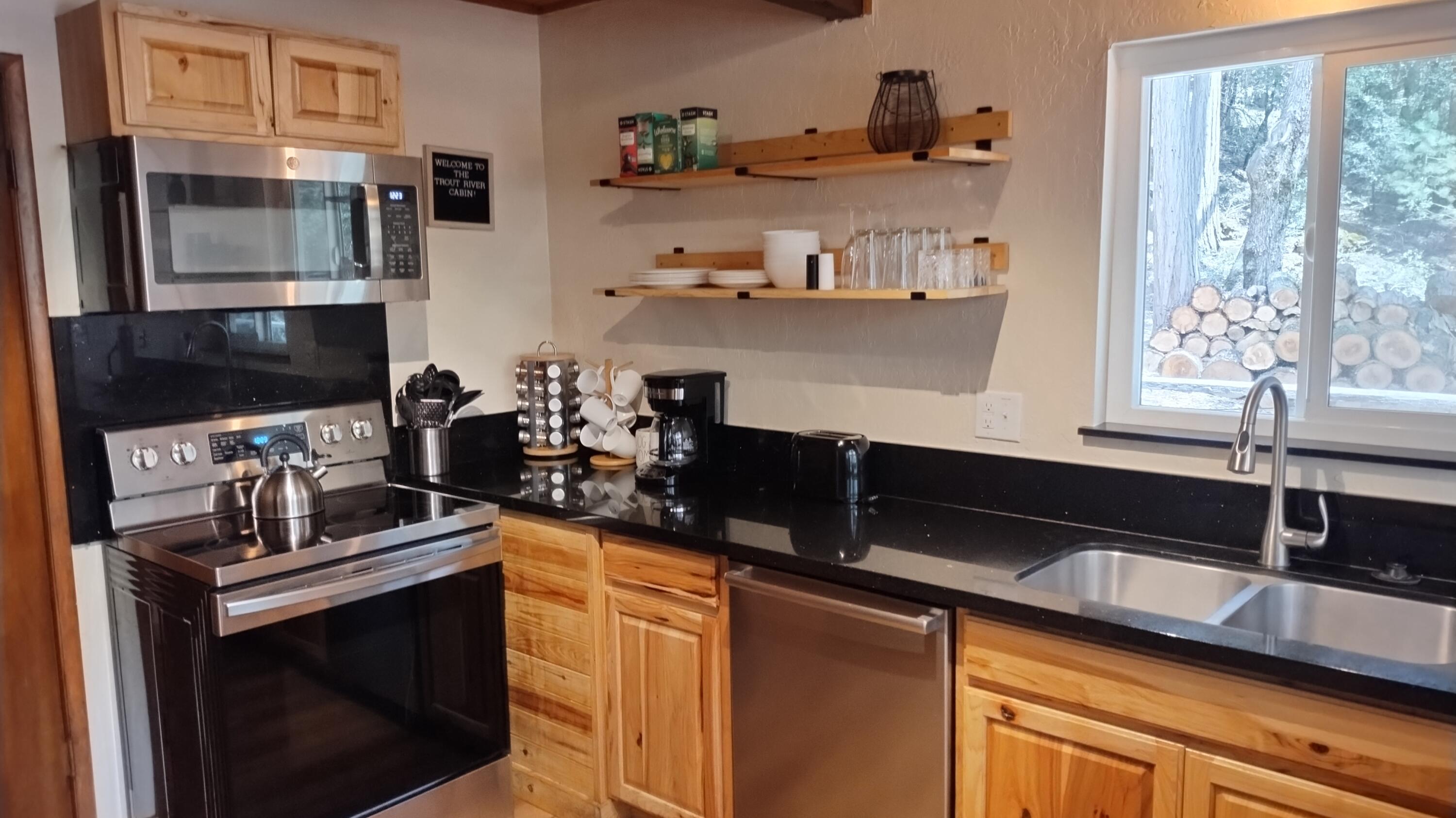 1693 Forest Rte 21S94 Camp Nelson, CA 93265 - Photo 15 of 86 a kitchen with stainless steel appliances a sink stove and microwave