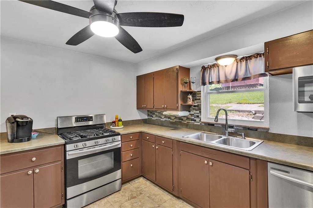 1117 Broughton Road Pittsburgh, PA 15236 - Photo 9 of 37 Kitchen with stainless appliances
