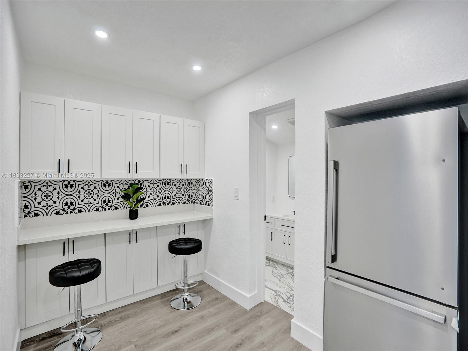 905 Southwest 22nd Street Fort Lauderdale, FL 33315 - Photo 12 of 25 a room with a table and chairs