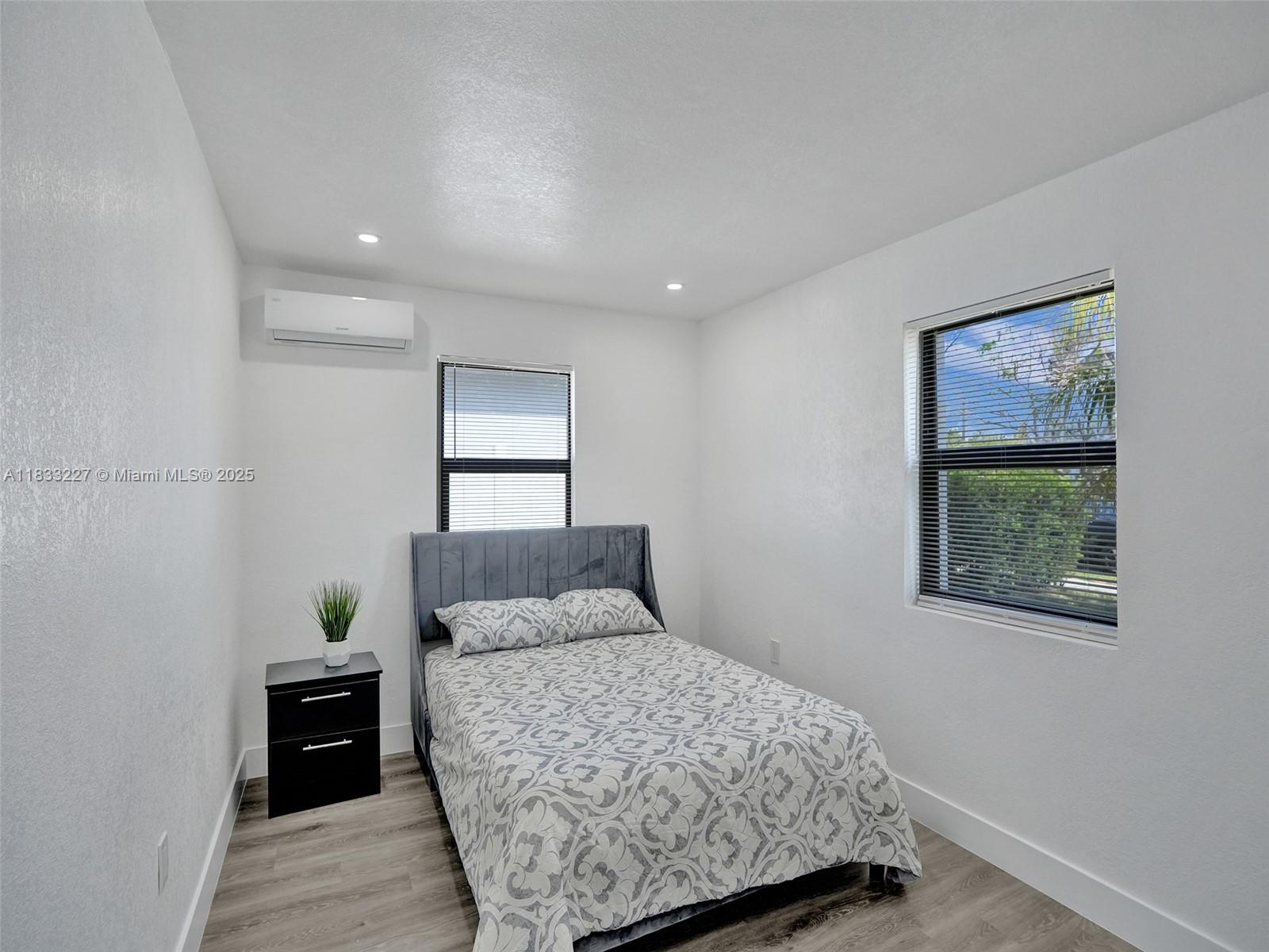 905 Southwest 22nd Street Fort Lauderdale, FL 33315 - Photo 13 of 25 a bedroom with a bed and a window