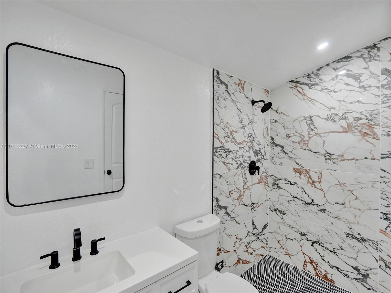 905 Southwest 22nd Street Fort Lauderdale, FL 33315 - Photo 14 of 25 a bathroom with a sink toilet and shower