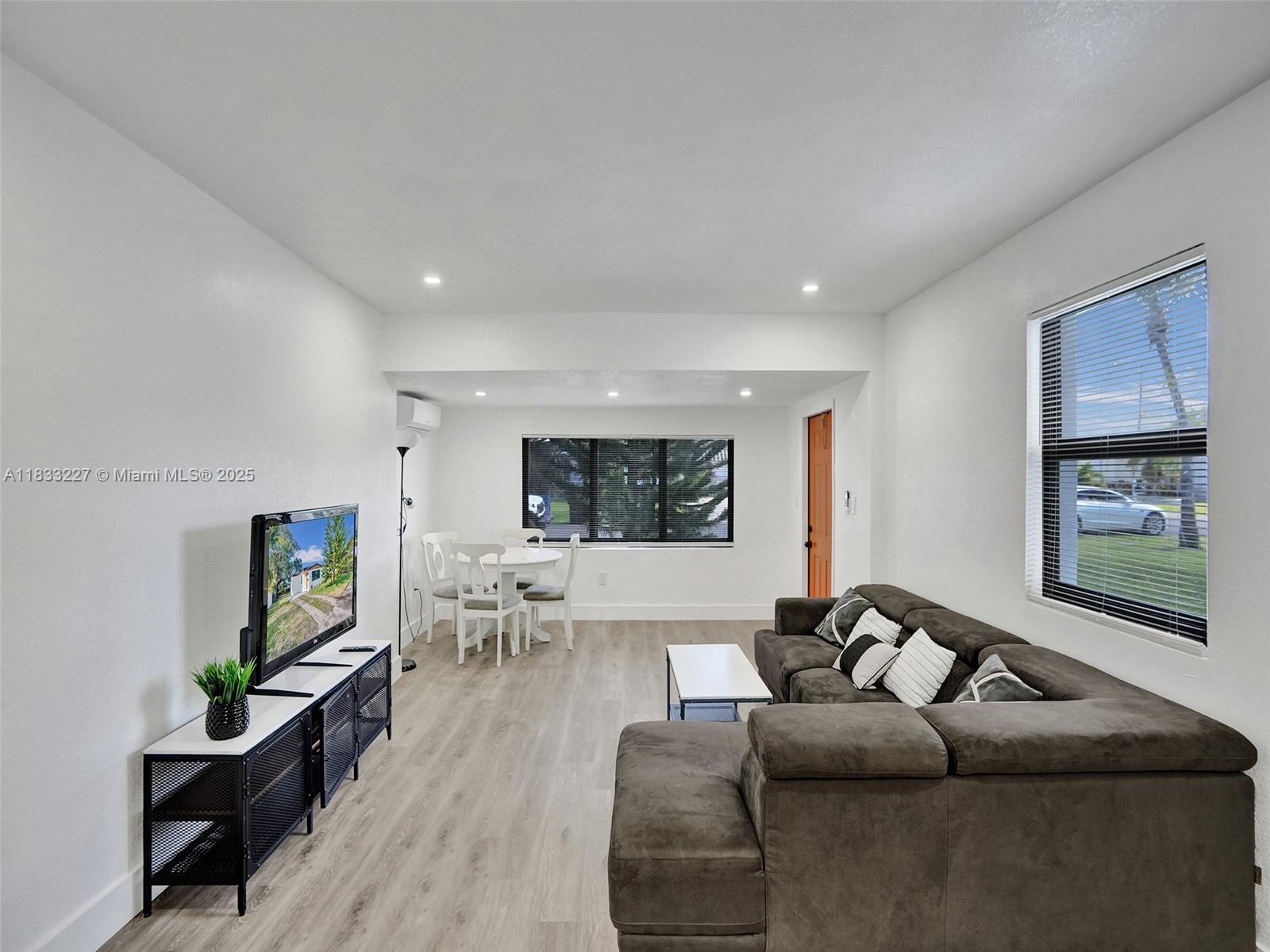 905 Southwest 22nd Street Fort Lauderdale, FL 33315 - Photo 5 of 25 a living room with furniture and a flat screen tv