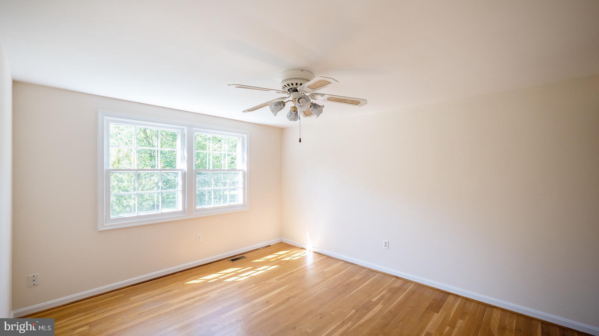 3017 Birchtree Lane Silver Spring, MD 20906 - Photo 30 of 39 Spare bedroom with ceiling fan and wood floors