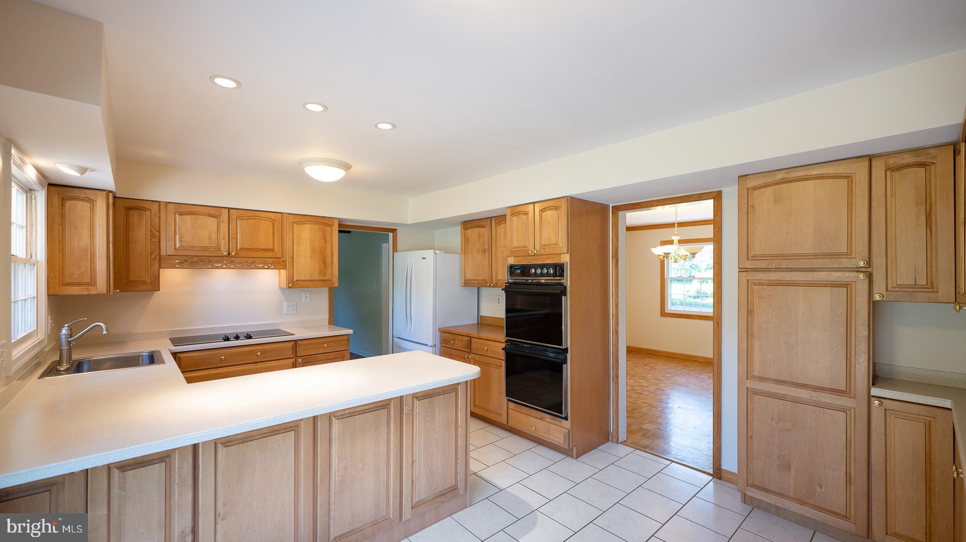 3017 Birchtree Lane Silver Spring, MD 20906 - Photo 8 of 39 Kitchen with maple cabinets