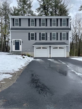 22 Folger Street Billerica, MA 01821 - Photo 1 of 17 a big house with large windows and palm trees