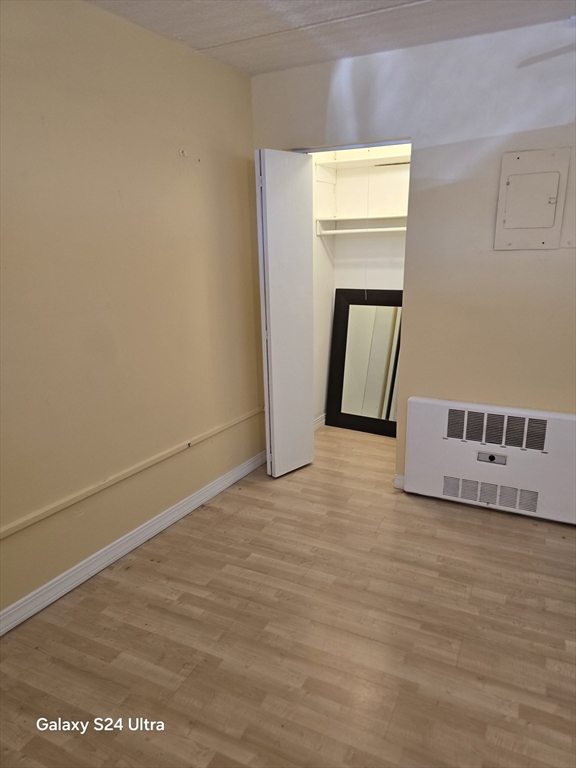 200 Swanton Street, Unit T35 Winchester, MA 01890 - Photo 12 of 36 a view of an empty room with wooden floor and a window