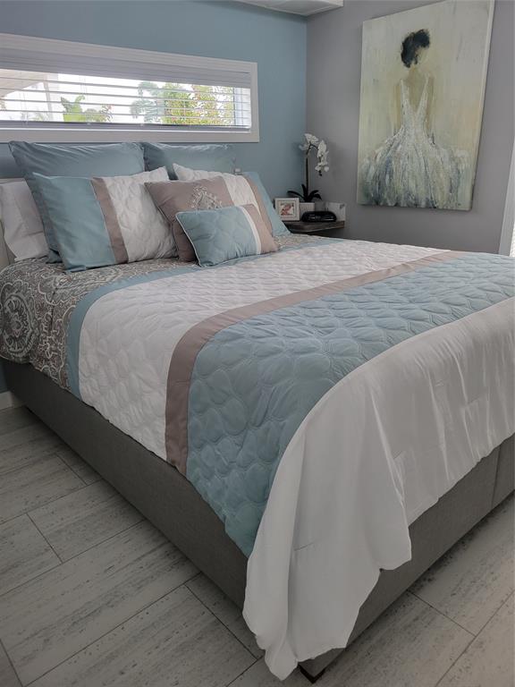 617 Southwest 34th Cove Okeechobee, FL 34974 - Photo 11 of 39 a bedroom with a bed and window