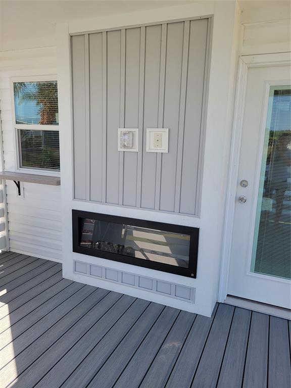 617 Southwest 34th Cove Okeechobee, FL 34974 - Photo 13 of 39 a view of an empty room with wooden floor and a window