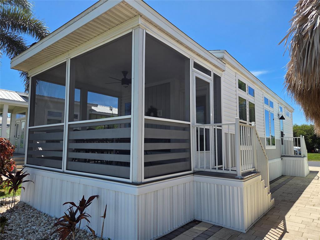 617 Southwest 34th Cove Okeechobee, FL 34974 - Photo 2 of 39 a view of a house with a door and wooden floor