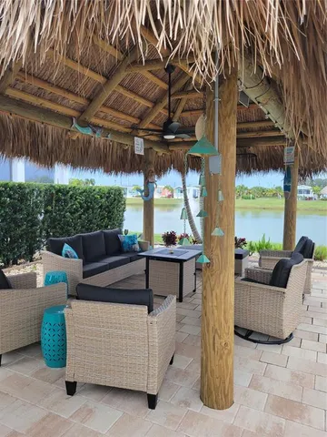 a outdoor living space with patio furniture and a potted plant