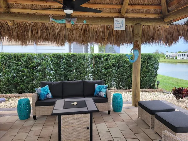 a view of an outdoor sitting area with furniture