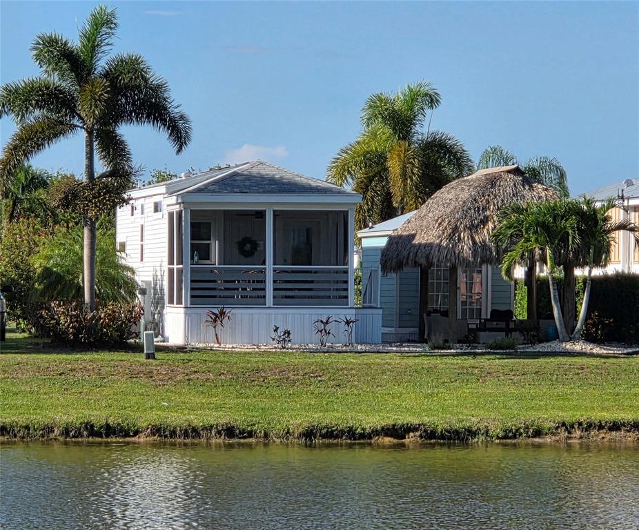 617 Southwest 34th Cove Okeechobee, FL 34974 - Photo 27 of 39 a view of a house with a swimming pool