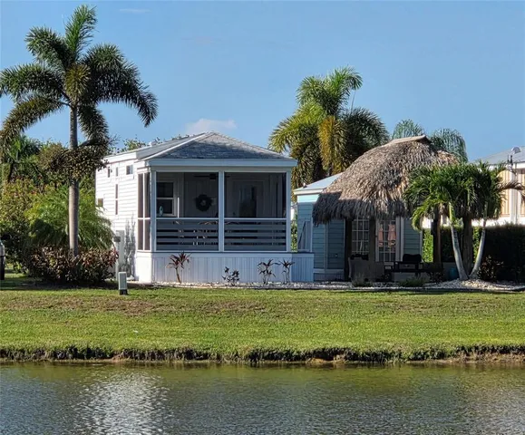a view of a swimming pool with a yard