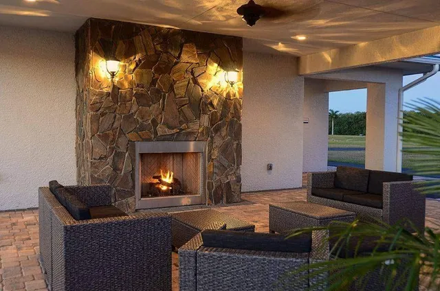 a living room with a couch and a bookshelf with wooden floor