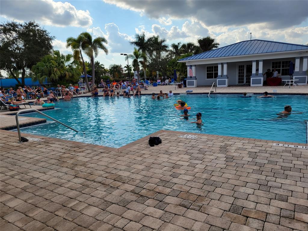 617 Southwest 34th Cove Okeechobee, FL 34974 - Photo 33 of 39 a view of a lake with a house