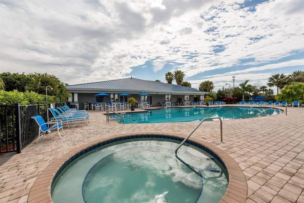 617 Southwest 34th Cove Okeechobee, FL 34974 - Photo 35 of 39 an outdoor space with swimming pool and furniture