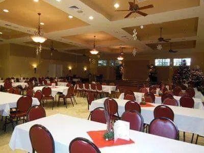 a view of a balcony with chairs and wooden floor