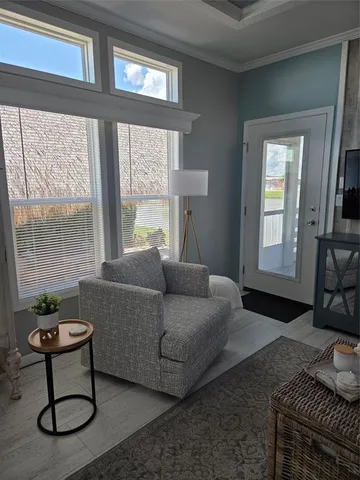 a living room with furniture and a window