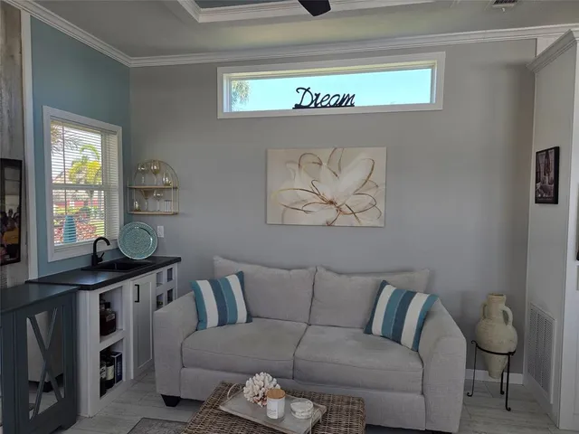 a living room with furniture and a window