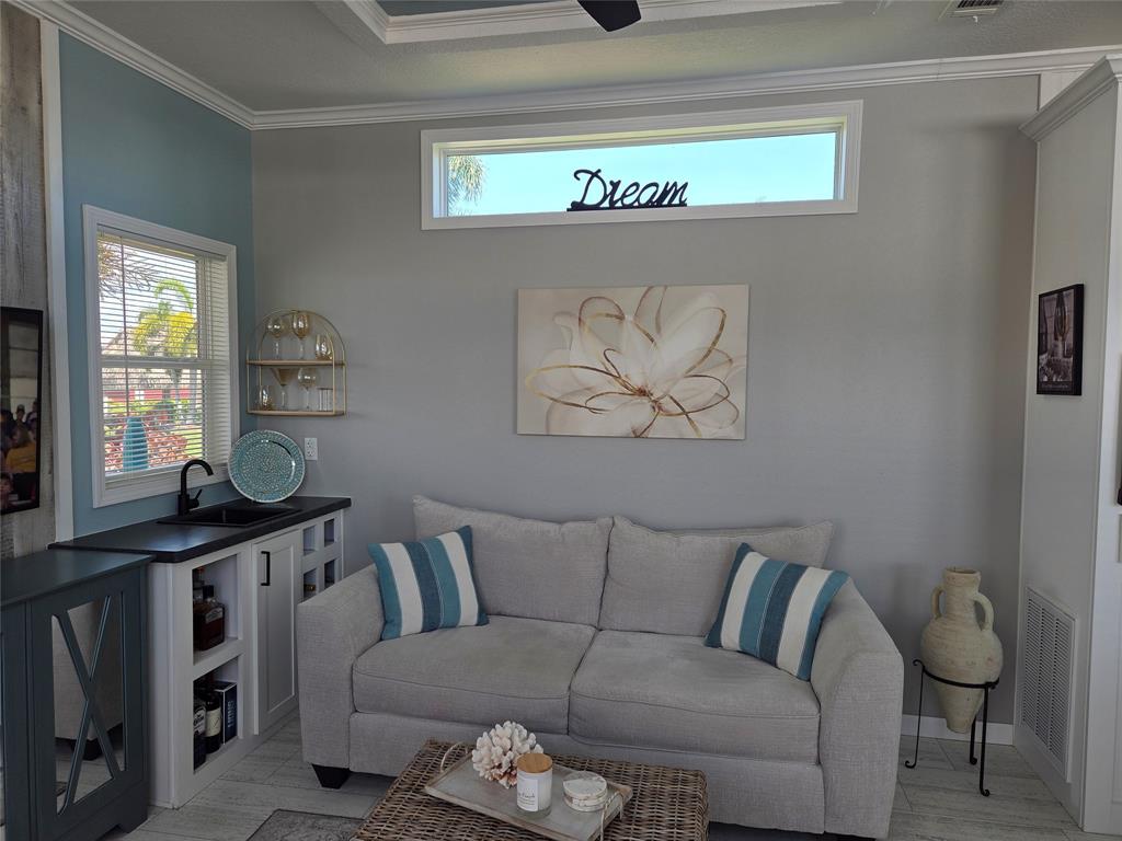 617 Southwest 34th Cove Okeechobee, FL 34974 - Photo 5 of 39 a living room with furniture and a window