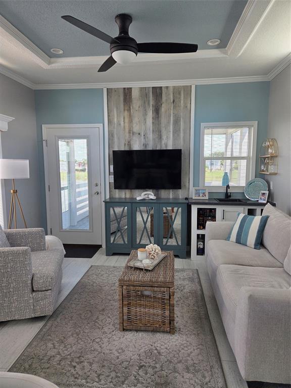 617 Southwest 34th Cove Okeechobee, FL 34974 - Photo 6 of 39 a living room with furniture and a flat screen tv