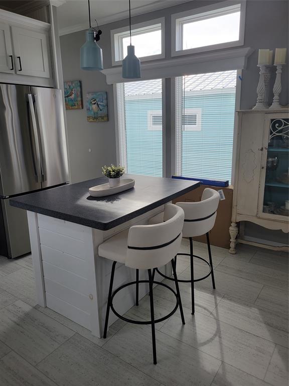 617 Southwest 34th Cove Okeechobee, FL 34974 - Photo 9 of 39 a table and chairs in a kitchen