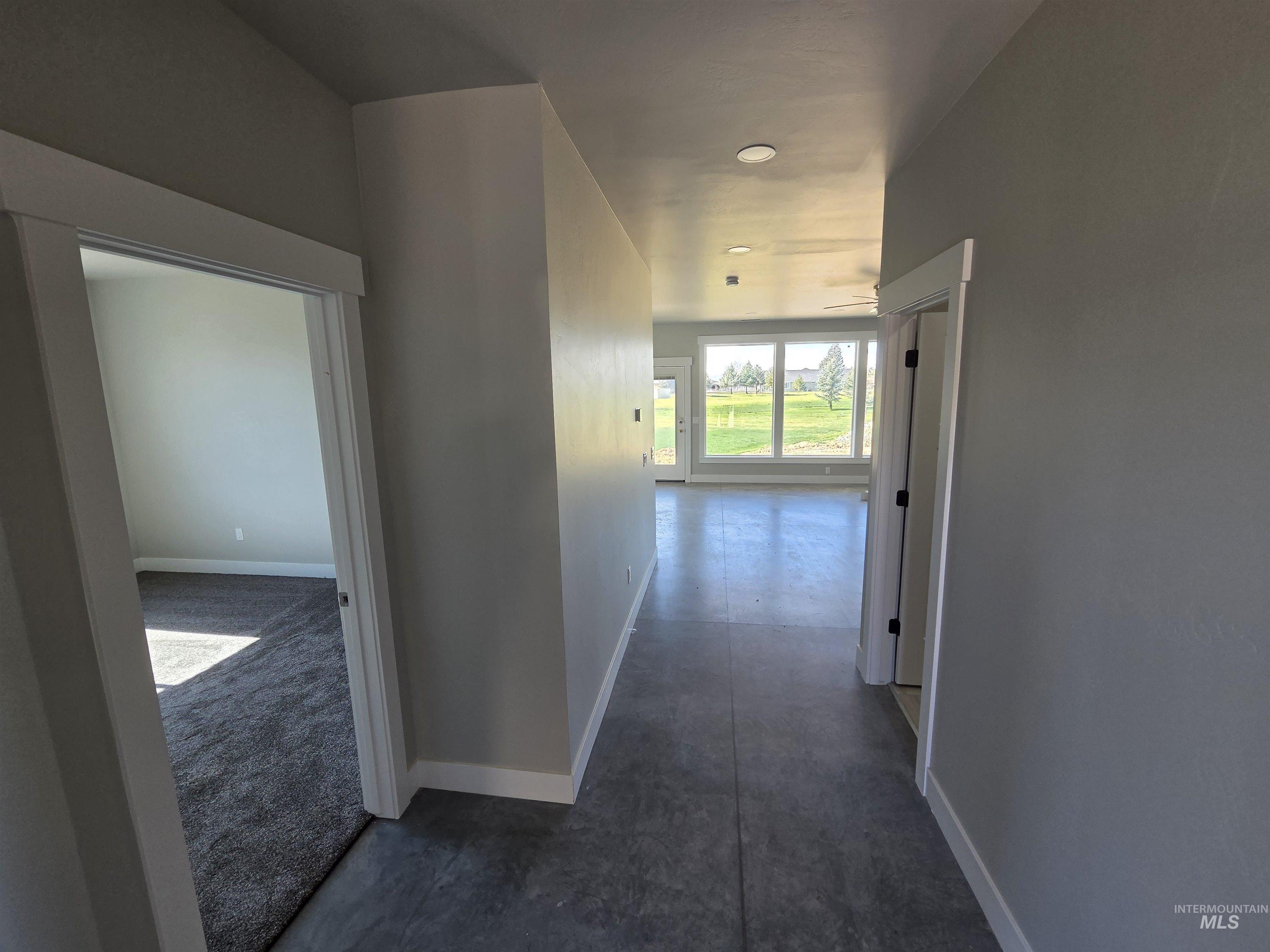 39 Lakeside Loop Burley, ID 83318 - Photo 2 of 15 Corridor featuring baseboards and concrete floors