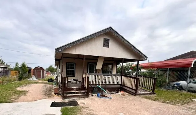 a front view of a house with parking area