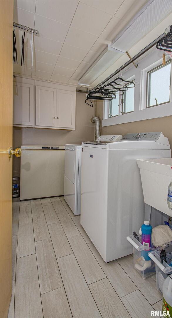 1114 South Perrine Centralia, IL 62801 - Photo 15 of 73 a utility room with cabinets washer and dryer