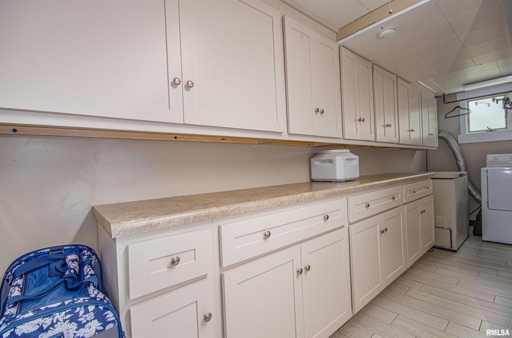 1114 South Perrine Centralia, IL 62801 - Photo 16 of 73 a kitchen with white cabinets and sink
