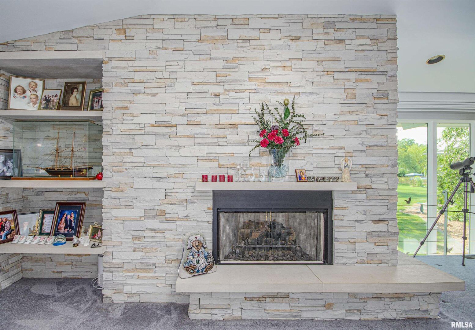 1114 South Perrine Centralia, IL 62801 - Photo 33 of 73 a hallway with a fireplace and a clock