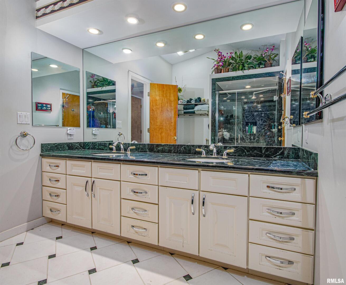 1114 South Perrine Centralia, IL 62801 - Photo 36 of 73 a bathroom with a granite countertop sink mirror and window