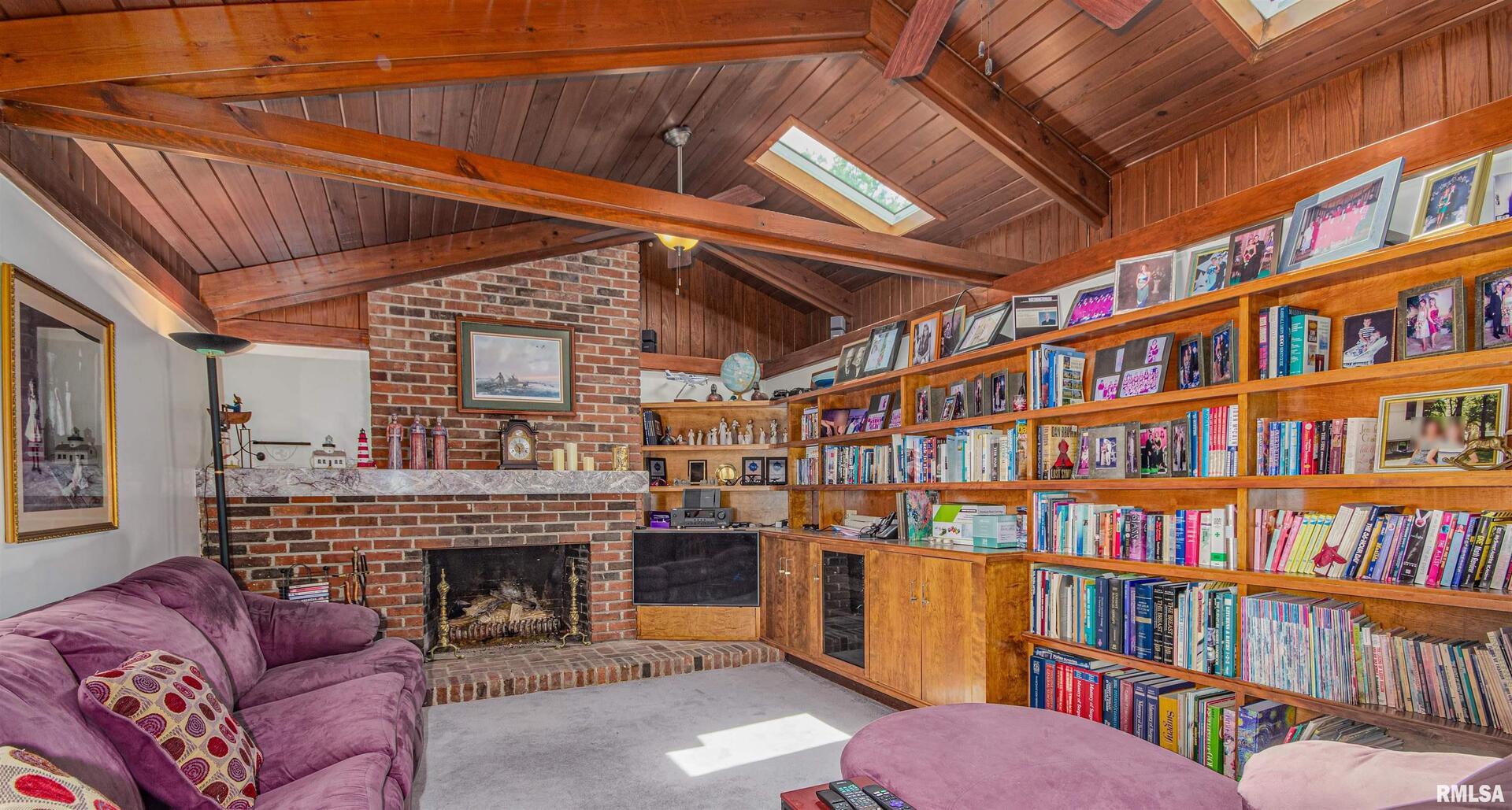 1114 South Perrine Centralia, IL 62801 - Photo 45 of 73 a living room with a bookshelf and a fireplace
