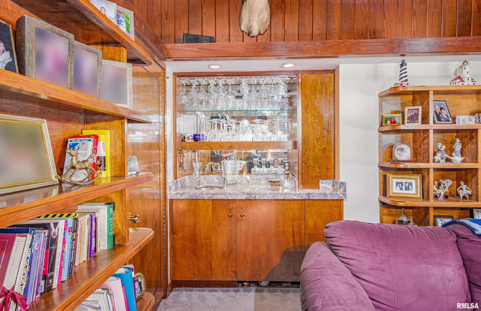 1114 South Perrine Centralia, IL 62801 - Photo 46 of 73 a living room with furniture and a book shelf