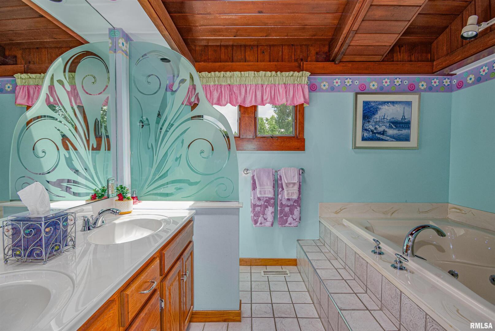 1114 South Perrine Centralia, IL 62801 - Photo 51 of 73 a bathroom with a sink a mirror and shower