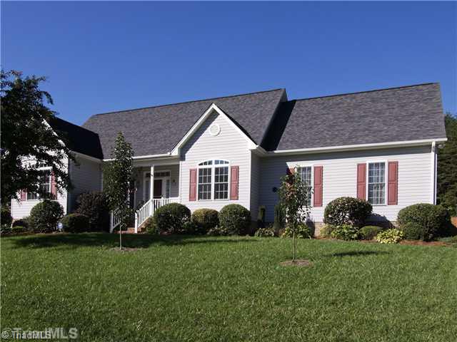 Exterior Front. Beautiful landscaping and charming front porch! Large 2 car garage with storage and extra large parking pad.