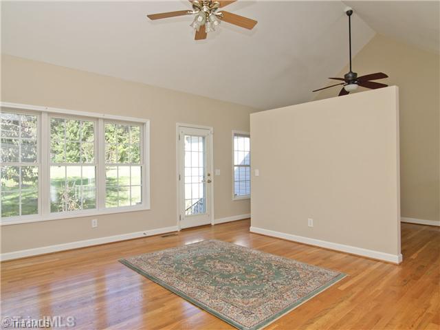 7809 Perthshire Drive Oak Ridge, NC 27310 - Photo 2 of 15 Living Room. Beautiful hardwoods, new neutural designer paint color, large and plentiful windows let in lots of natural light, and show the lovely view of the back yard.
