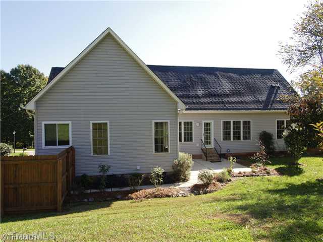 7809 Perthshire Drive Oak Ridge, NC 27310 - Photo 14 of 15 Exterior Back. Large patio and beautiful landscaping set off the large fenced in back yard. Remember the gas grill remains, as does the gas outdoor heater, so this space will be an extension of your home!