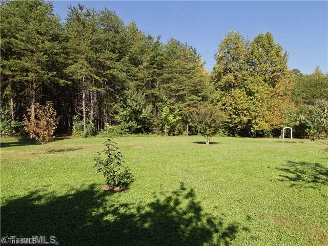 7809 Perthshire Drive Oak Ridge, NC 27310 - Photo 15 of 15 Land. This home is situated on just over an acre. Huge backyard is great to play, entertain, and plenty of space for the gardner in the family.