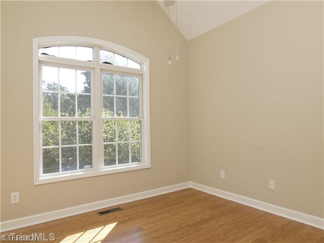 7809 Perthshire Drive Oak Ridge, NC 27310 - Photo 8 of 15 2nd Bedroom. More natural light, with these beautiful windows with lovely architectural detail.