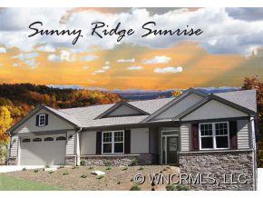 144 Sunny Ridge Road Laurel Park, NC 28739 - Photo 2 of 12 a view of a house with a yard