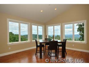 144 Sunny Ridge Road Laurel Park, NC 28739 - Photo 4 of 12 a view of a dining room with furniture and window