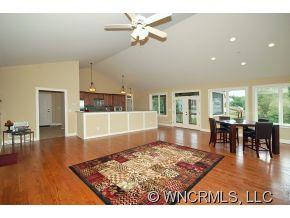144 Sunny Ridge Road Laurel Park, NC 28739 - Photo 6 of 12 a living room with furniture and a wooden floor