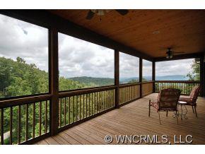 144 Sunny Ridge Road Laurel Park, NC 28739 - Photo 8 of 12 a view of a chairs and table in the balcony