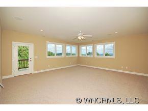 144 Sunny Ridge Road Laurel Park, NC 28739 - Photo 10 of 12 a view of an empty room with a window