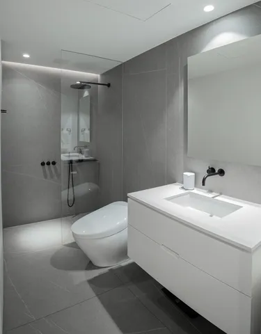 a bathroom with a sink and mirror