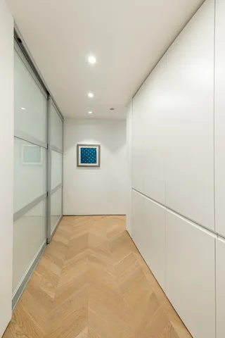 a view of swimming pool with outdoor seating and a lots of trees in the background